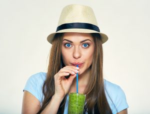 Smiling,Young,Woman,Drinking,Green,Smoothie,Juice.,Isolated,Portrait.